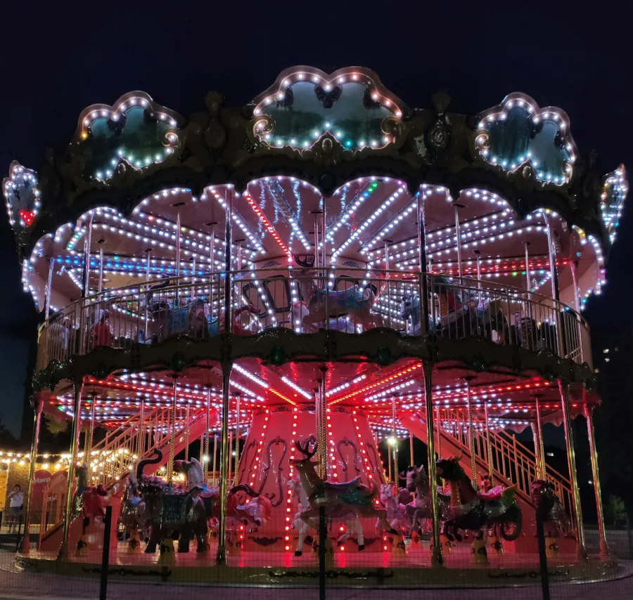 A merry go round lit up at night