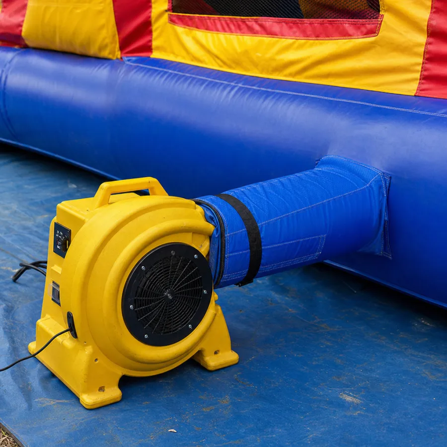 Close-up of a commercial air blower inflating a large party structure