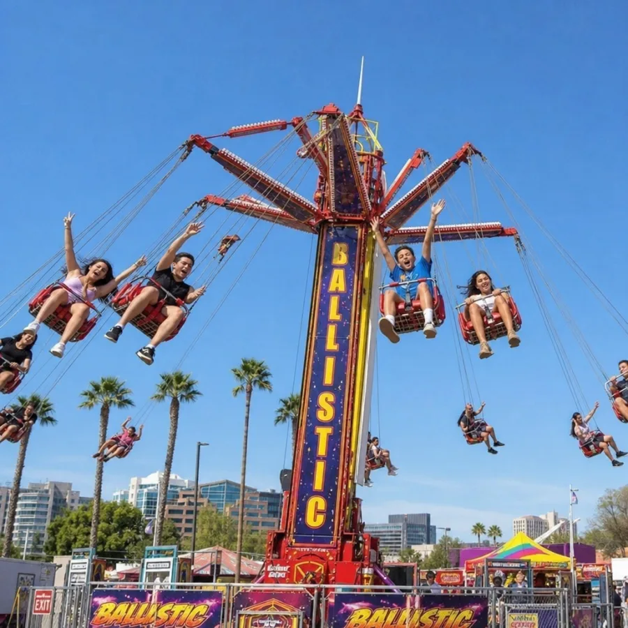 Excited guests enjoying a high-speed ballistic carnival swing ride under the sunny Phoenix sky