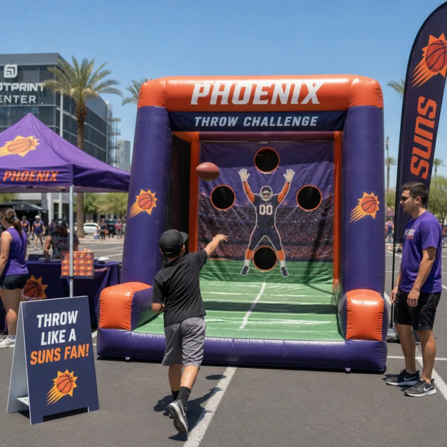 Inflatable football throw game set up at a Phoenix outdoor event