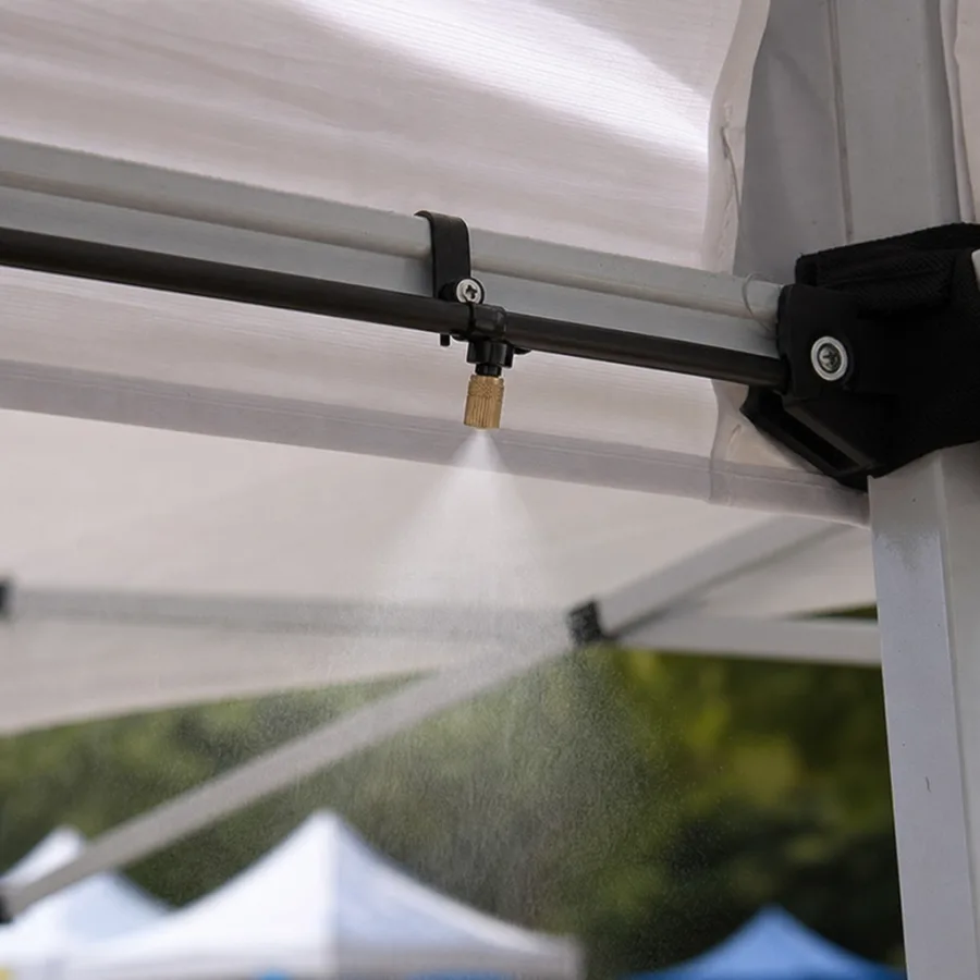 Close-up of a fine misting line attached to an outdoor event canopy