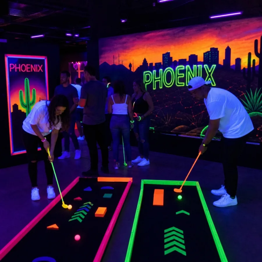 Guests playing neon blacklight games at an indoor Phoenix event