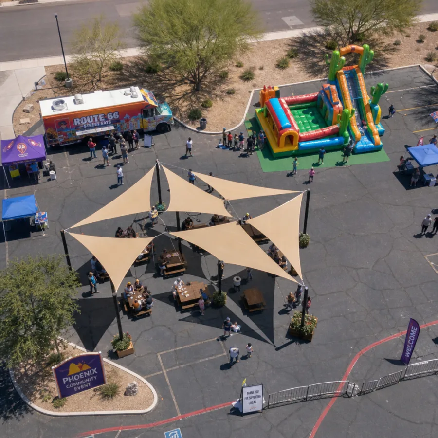 Aerial style view of Phoenix outdoor event layout with food truck, shaded seating, and inflatable play area
