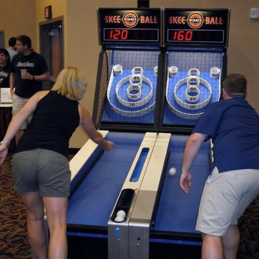 Guests competing on a double skee ball arcade rental