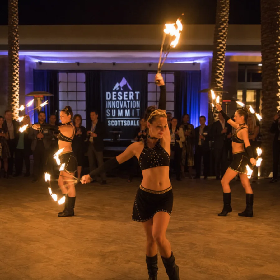 Choreographed fire dancing troupe performing at a corporate event in Scottsdale