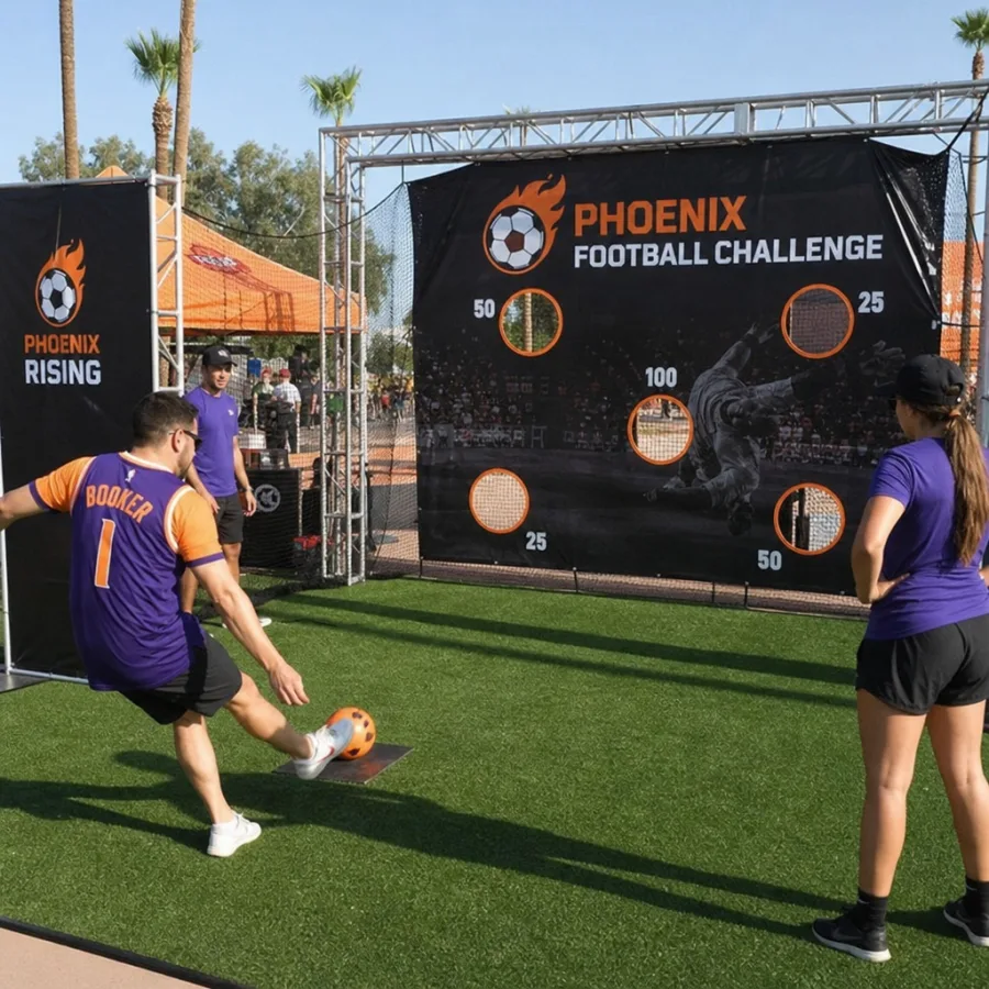 Guests playing an interactive football challenge at a Phoenix outdoor event