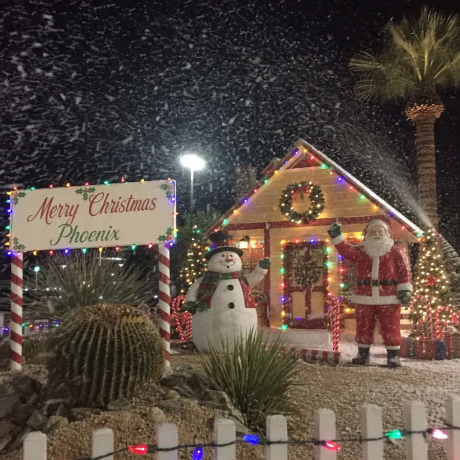 Artificial snow blowing around a Christmas display in Phoenix