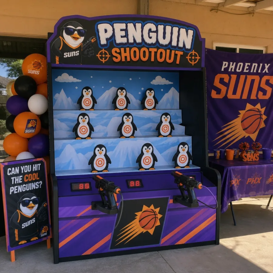Penguin-themed arcade shootout game set up at a Phoenix party