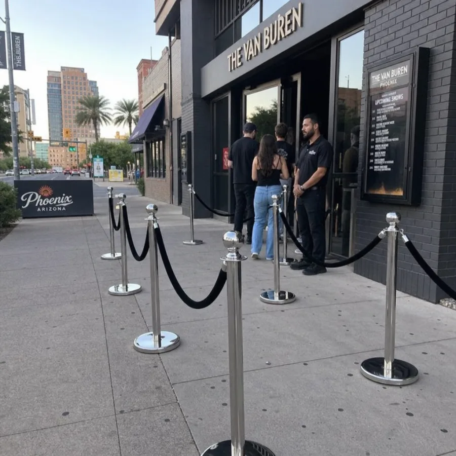Chrome stanchion line outside a Phoenix venue entrance