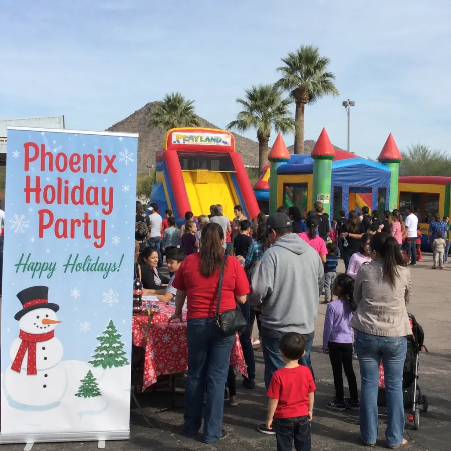 Phoenix holiday party with inflatable playland and families