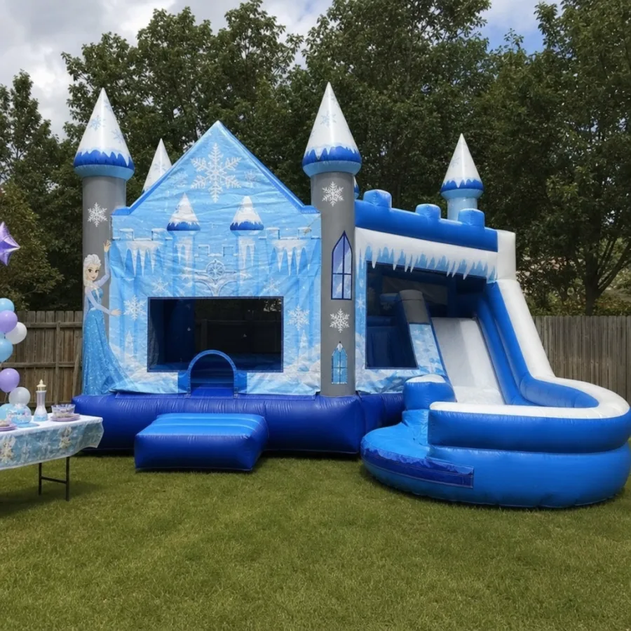 Ice castle bounce house with slide set up for a backyard party