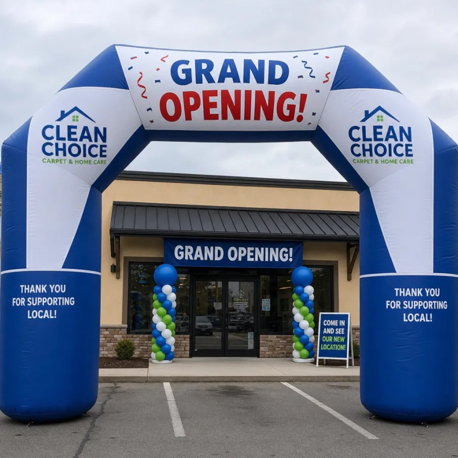 A giant branded inflatable archway set up for a local business grand opening event